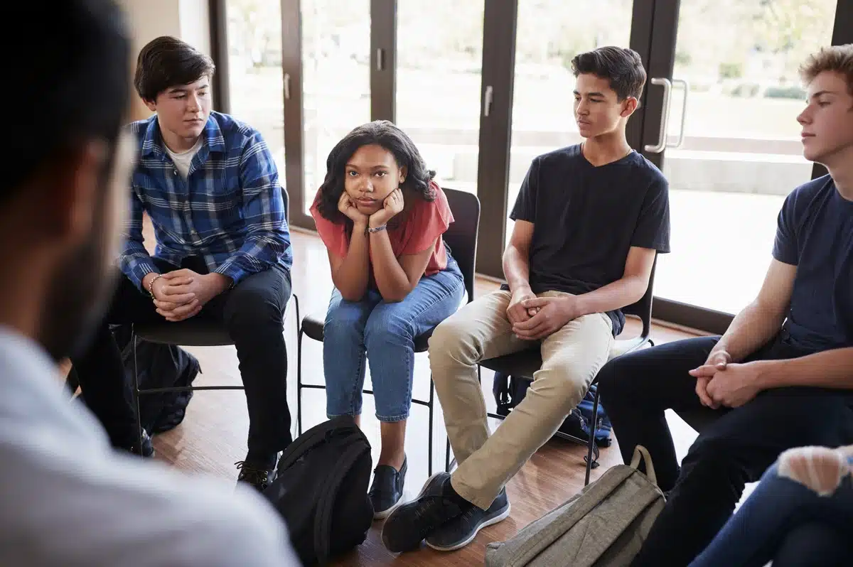 Why Mental Health Matters in Adolescence - unhappy teen at group therapy